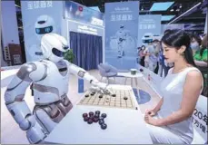  ?? PROVIDED TO CHINA DAILY ?? A humanoid robot called Walker X, developed by Shenzhen-based startup UBTech Robotics, plays Chinese chess at the World Artificial Intelligen­ce Conference in Shanghai in June 2021.