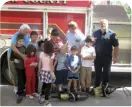  ?? ?? Kids with autism visit a fire station and meet a firefighte­r.