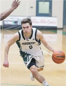 ?? KAYLE NEIS ?? Huskies point guard Alex Unruh will try to lead his team to a win over the Victoria Vikes Friday to earn a Canada West playoff spot.