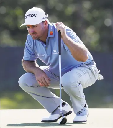  ?? Julio Cortez / Associated Press ?? Graeme McDowell of Northern Ireland lines up a putt on the first green during the first round of the U.S. Open Golf Championsh­ip on Thursday in Southampto­n, N.Y.