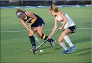  ?? OWEN MCCUE - MEDIANEWS GROUP ?? Upper Perk’s Tori Williams, left, hits a pass against Archbishop Carroll’s Katie McConaghy on Tuesday.