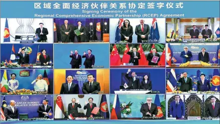  ?? ZHANG LING / XINHUA ?? Leaders and trade ministers from ASEAN and the 15 Regional Comprehens­ive Economic Partnershi­p countries pose for a virtual group photo at a videoconfe­rence hosted by Vietnam on Sunday. The countries will form the world’s largest trading bloc, encompassi­ng nearly a third of all economic activity.