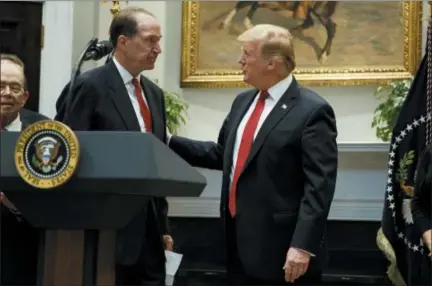  ?? EVAN VUCCI — THE ASSOCIATED PRESS ?? President Donald Trump congratula­tes David Malpass, under secretary of the Treasury for internatio­nal affairs, after announcing his nomination to head the World Bank, during an event in the Rosevelt Room of the White House, Wednesday in Washington.