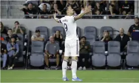  ??  ?? Zlatan Ibrahimovi­c celebrates another goal for the Galaxy. Photograph: Marcio José Sánchez/AP