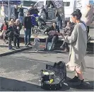  ?? PHOTO: SUPPLIED ?? Famous spectator . . . Pink (crouching, with cup) and children Willow (7) and Jameson (1) watch Dunedin busker Deina SusiloKnox on Saturday.