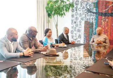  ?? ?? Tony Elumelu (R), Senator John Enoh and members of his team during a meeting in Lagos