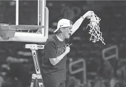  ?? KIRBY LEE/USA TODAY SPORTS ?? Stanford coach Tara Vanderveer cuts down the net after the Cardinal won the national championsh­ip game on Sunday in San Antonio.