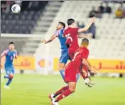  ?? AIFF ?? India (in blue) and Qatar players slug it out during their World Cup qualifier in Doha on Tuesday.