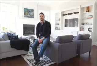  ?? CATHIE COWARD, THE HAMILTON SPECTATOR ?? Home builder Ryan Castelli relaxes in his own Dundas home.