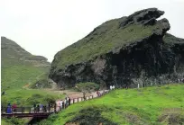  ?? Ahmed Jadallah / Reuters ?? Tourists visit a cave in Salalah. The area had 580,000 visitors in the first six months of this year.