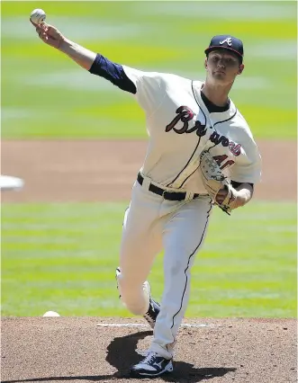  ?? MIKE ZARRILLI/GETTY IMAGES ?? Calgary’s Mike Soroka throws a pitch for the Atlanta Braves during Sunday’s game against the San Francisco Giants at SunTrust Park in Atlanta, Ga. Soroka only made it to the fourth inning.