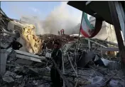  ?? OMAR SANADIKI — THE ASSOCIATED PRESS ?? Emergency services personnel work at a destroyed building hit by an air strike in Damascus, Syria, Monday.