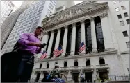  ?? AP FILE PHOTO BY RICHARD DREW ?? In this 2016 photo, a man walks by the New York Stock Exchange.