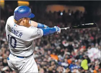  ?? Wally Skalij Los Angeles Times ?? JUSTIN TURNER, hitting a two-run home run against the San Francisco Giants last week, is one of the toughest outs in baseball. Turner batted .356 after the All-Star break.