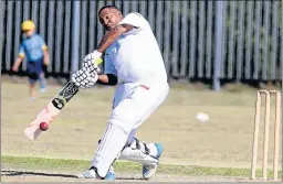  ?? Picture: EUGENE COETZEE ?? BIG HIT: Jendamark United’s Remano Esau swings in the Vernon Malgas Double Wicket final against Madibaz 1