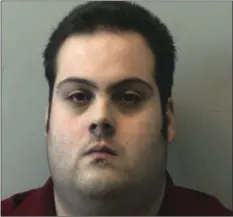  ??  ?? This booking photo released on Thursday, by the Beverly Police Department shows Daniel Frisiello, of Beverly, Mass., accused of mailing five envelopes earlier this month with threatenin­g messages and a white substance, including one to Donald Trump...