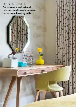  ??  ?? DRESSING TABLE
Debra uses a walnut and oak desk and a wall-mounted mirror as a dressing table