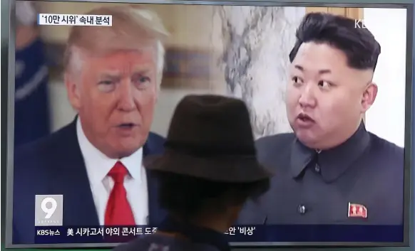  ?? AP ?? A South Korean in the capital, Seoul, watches coverage of the bad tempered brinkmansh­ip and threats between president Donald Trump and Kim Jong-un