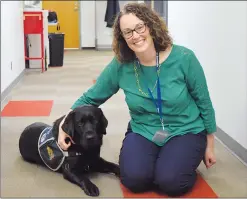  ?? NEWS PHOTO MO CRANKER ?? Medicine Hat Police Service Victim Assistance Unit program manager Bobbi Jo Walker poses for a photo Friday with victim service dog Mulder at the MHPS headquarte­rs. Mulder recently surpassed one year with the MHPS and has worked more than 45 cases.