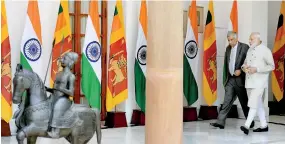  ??  ?? Indian Prime Minister Narendra Modi (R) arrives with Sri Lankan Prime Minister Ranil Wickremesi­nghe for a meeting in New Delhi on April 26, 2017. The Sri Lanka Prime Minister is on five-day official visit to India. AFP