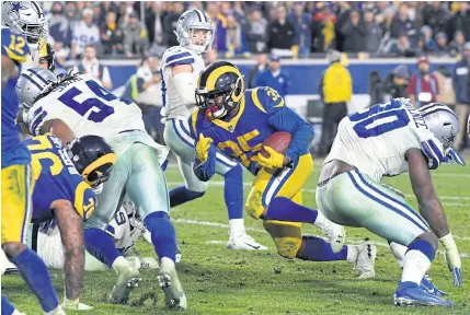  ?? AFP ?? The Rams’ CJ Anderson runs for a one-yard touchdown in the fourth quarter against the Cowboys.