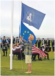  ??  ?? Belle Robertson MBE, guest of honour, raised the flags at the opening ceremony of the 10th bienniel Hickory Grail competitio­n; Kintyre Schools Pipe Band and Campbeltow­n Brass played during the ceremony.