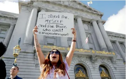  ?? AP ?? Elena Sanchez joins a protest against President Donald Trump’s move to crack down on immigratio­n in San Francisco. —