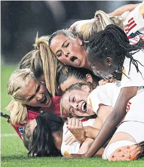  ?? ANP VIA GETTY IMAGES ?? Lyon players celebrate after winning the Women’s Champions League final on Saturday.