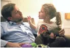  ??  ?? Frazer Gieselmann works on vocalizati­on with daughter Elle, 4, who is part of a clinical study for Batten disease.