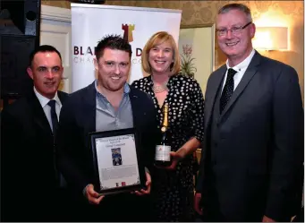  ??  ?? Blarney United FC coach Greg Constant receiving his monthly award from awards organisers Cllr Damian Boylan, Kate Durrant and John Henchion.