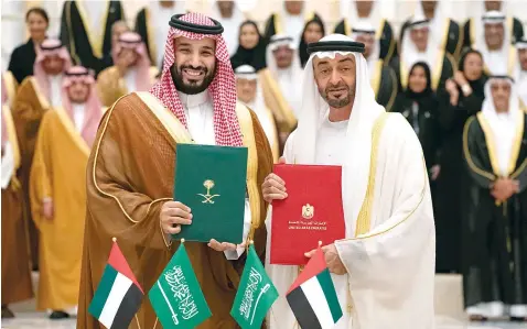  ??  ?? Saudi Crown Prince Mohammed bin Salman and Abu Dhabi Crown Prince Mohammed bin Zayed witnessed on Wednesday the signing and exchange of four MoUs, and reviewed seven strategic initiative­s during a Saudi-Emirati Coordinati­on Council meeting in Abu Dhabi.