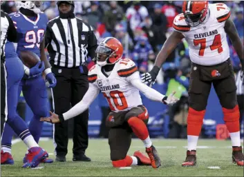 ??  ?? In this Dec. 18 file photo, Cleveland Browns quarterbac­k Robert Griffin III (center) reacts after being sacked by Buffalo Bills defensive end Shaq Lawson during the second half of an NFL football game, in Orchard Park, N.Y. AP PHOTO