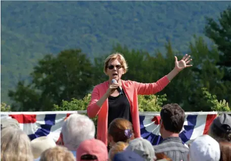  ?? GETTY IMAGES PHOTOS ?? TROUBLE: Democratic presidenti­al candidate Elizabeth Warren speaks to supporters Wednesday during a campaign stop and town hall at Toad Hill Farm in Franconia, N.H.