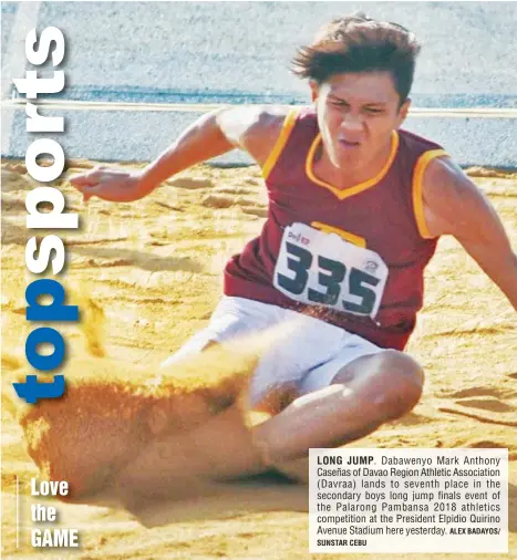  ?? SUNSTAR CEBU ALEX BADAYOS/ ?? LONG JUMP. Dabawenyo Mark Anthony Caseñas of Davao Region Athletic Associatio­n (Davraa) lands to seventh place in the secondary boys long jump finals event of the Palarong Pambansa 2018 athletics competitio­n at the President Elpidio Quirino Avenue...