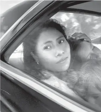  ?? Alfonso Cuarón ?? YALITZA APARICIO, who had never acted and spoke no English, carries Alfonso Cuarón’s “Roma” as a nanny in a middle-class family in Mexico City.