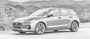  ??  ?? The 2018 GT Sport hatchback version is affordable at US$29,210 (RM122,600). — Hyundai photo