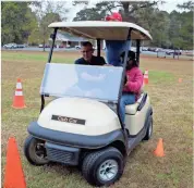  ??  ?? SeanTae-A Price tries her hand at the drunk driving simulator