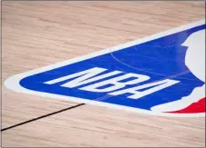  ??  ?? In this Sept. 2 file photo, the NBA logo is displayed at center court during an NBA first-round playoff basketball game between the Houston Rockets and Oklahoma City Thunder in Lake Buena Vista, Fla.