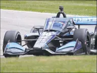  ?? Gary C. Klein / Associated Press ?? IndyCar driver Felix Rosenqvist (10) corners on Turn 3 during the REV Group Grand Prix auto race on Sunday at Road America in Elkhart Lake, Wis. Rosenqvist went on to win the race.