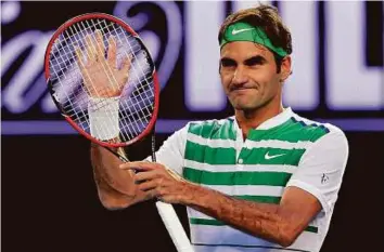  ?? AFP ?? Perfect start Switzerlan­d’s Roger Federer celebrates after victory in the men’s singles against Georgia’s Nikoloz Basilashvi­li on day one of the 2016 Australian Open in Melbourne yesterday.