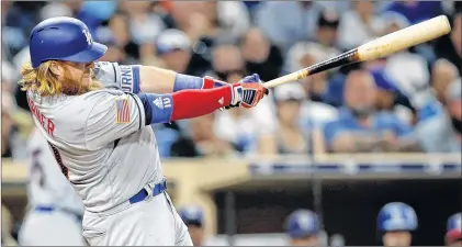  ?? Ap photo ?? In this July 1 file photo, Los Angeles Dodgers’ Justin Turner hits a solo home run during the fifth inning of a game against the San Diego Padres in San Diego.