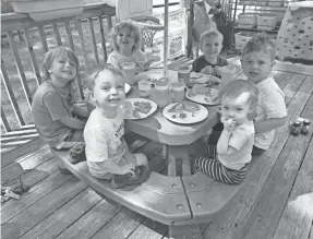  ?? PROVIDED BY EMILY RODENBECK ?? Children eat lunch at Emily Rodenbeck’s former day care, which she ran out of her Michigan home until 2019.