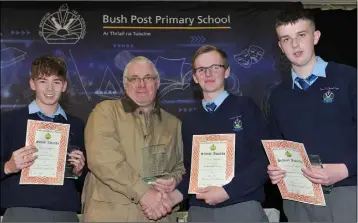  ??  ?? Stephen Gearon presents the Sheelan Kitchen’s Junior Wood Technology award to Andrew O’Neill with Arán Ralph andf Colin Kane, Highly Commended at the Bush Post Primary Annual School Awards