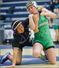  ?? (NWA Democrat-Gazette/Ben Goff) ?? TOP Tristan Stafford (left) of Bentonvill­e won his second consecutiv­e Class 6A state wrestling title at 106 pounds, and for that, he was honored as the AllNWADG Boys Wrestler of the Year. RIGHT Van Buren’s Addison Loney (right) claimed the first Arkansas Activities Associatio­n-sanctioned Arkansas girls high school wrestling state title at 140 pounds this season. She has been chosen as the All-NWADG Girls Wrestler of the Year for her accomplish­ments.