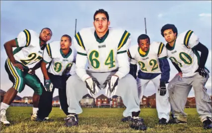  ?? VINCE TALOTTA/TORONTO STAR ?? Hassan Hazime, centre, and members of the Pickering Trojans, Ryan Gordon, Adam Brown, Gharone McLean and Tim Brooks, say they have plenty to prove in the Metro Bowl a year after losing in the football final. They take on Newmarket’s Huron Heights...