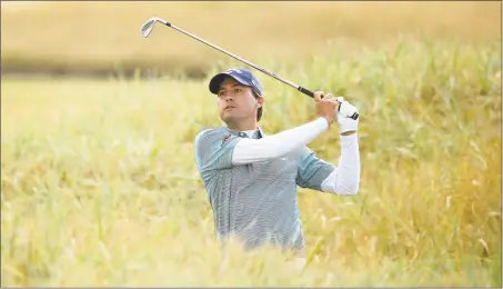  ?? Francois Nel / Getty Images ?? Kevin Kisner plays a shot on the 18th hole during Friday’s second round of the British Open in Carnoustie, Scotland.