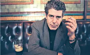  ??  ?? Anthony Bourdain in 2001 and (below) his memoir Kitchen Confidenti­al (2000): he claimed that most chefs he worked with were ‘drunks, sneak thieves, sluts and psychopath­s’