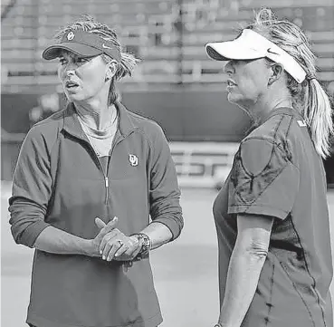  ?? [PHOTO BY CHRIS LANDSBERGE­R, THE OKLAHOMAN] ?? OU pitching coach Melyssa Lombardi, left, was named the nation’s top assistant softball coach Monday. She has been on head coach Patty Gasso’s staff for 21 years.