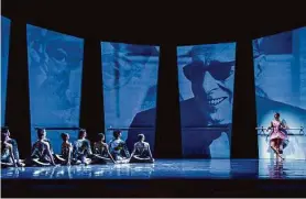  ?? ?? Projection­s of Stravinsky’s face appear on panels as Mukhamedov (right) stands at a barre in “Violin Concerto.”