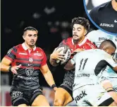  ?? ?? Antoine Dupont, Romain Ntamack et Thomas Ramos ont une relation privilégié­e dans le jeu que détaille leur entraîneur au Stade toulousain, Clément Poitrenaud.